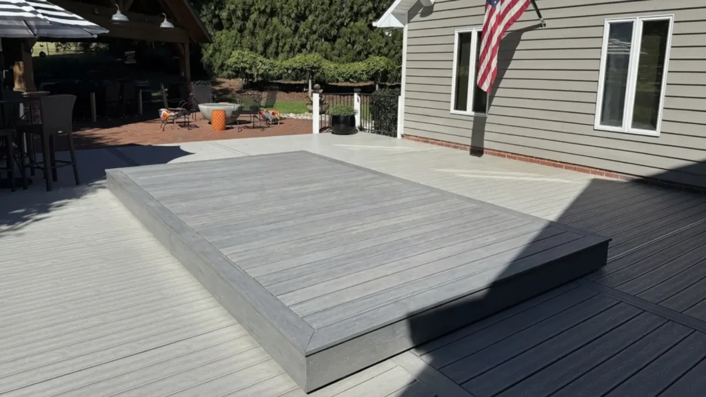 S-LIDE - Sliding Deck Pool Cover covered with gray composite decking