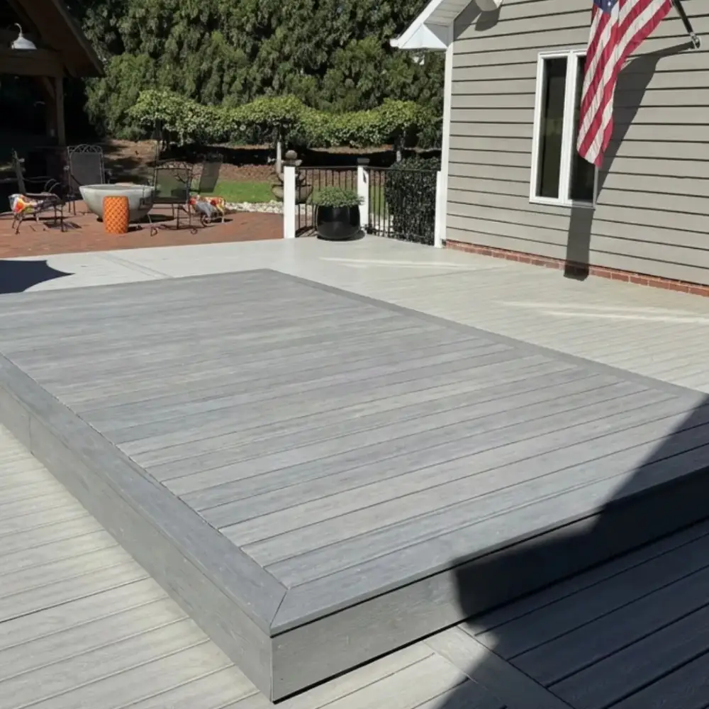 S-LIDE - Sliding Deck Pool Cover covered with gray composite decking
